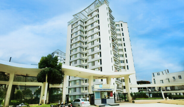 I-Life residential building with contemporary design and green spaces.